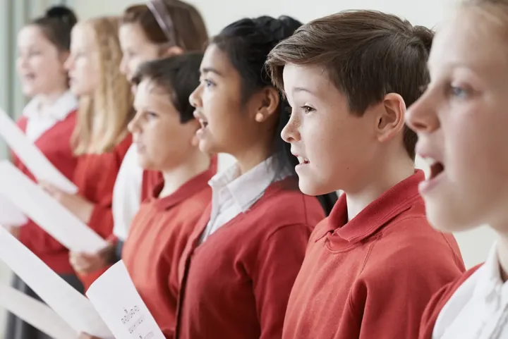 Children singing in a choir community activity image